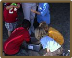 Students Looking at Sand Crabs